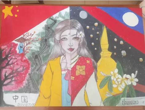 任教学校的高三同学们共同完成的画作,将中国、老挝的标志性建筑、传统服饰等元素融合在一起,表达了就是中老两国的友好、互助和美好祝愿。(作者供图) 任教学校的高三同学们共同完成的画作,将中国、老挝的标志性建筑、传统服饰等元素融合在一起,表达了就是中老两国的友好、互助和美好祝愿。(作者供图)